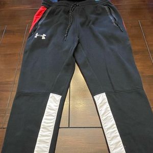 Under Armour track pants.  XL
